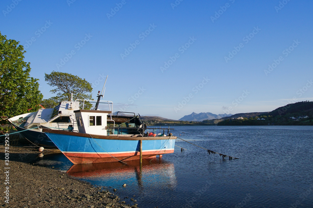 Old fishing boats on Loch Portree on the Isle of Skye Old fishing boats on Loch Portree on the Isle of Skye
