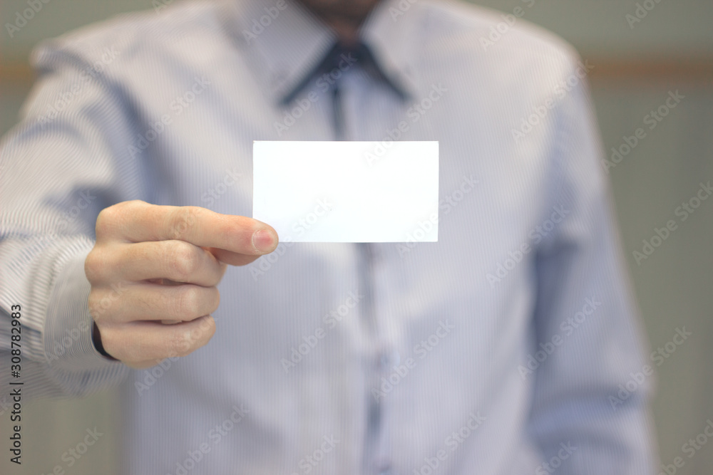 Close-up of business card in business man hand Close-up of business card in business man hand