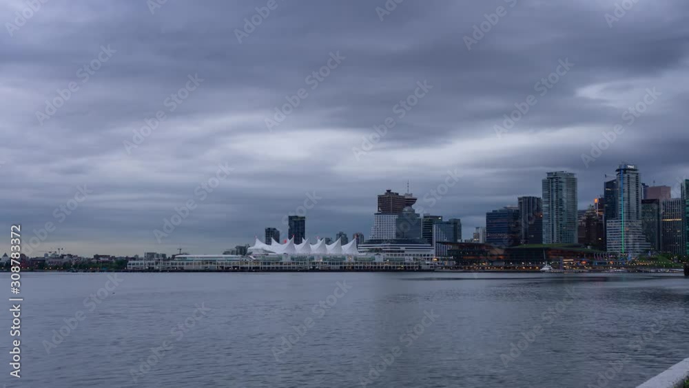 Time Lapse of Beautiful view of Vancouver Downtown during a morning sunrise. Picture taken from Stanley Park in British Columbia, Canada. Time Lapse of Beautiful view of Vancouver Downtown during a morning sunrise. Picture taken from Stanley Park in British Columbia, Canada.