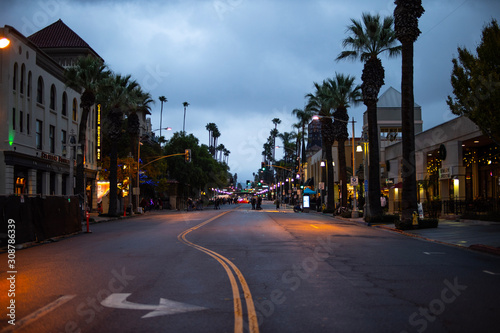 Fotótapéta Downtown California street with palm trees at evening