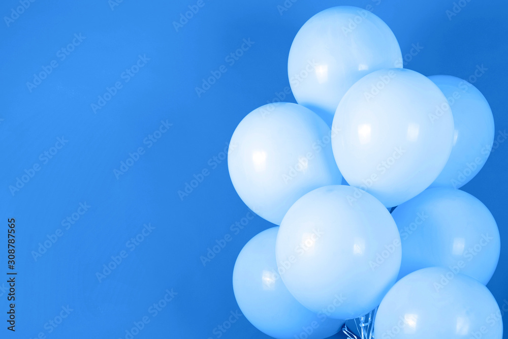 Classic blue background with bunch of flying balloons, copy space for text. Color of the year 2020. Christmas, birthday, valentine, wedding, holiday concept Classic blue background with bunch of flying balloons, copy space for text. Color of the year 2020. Christmas, birthday, valentine, wedding, holiday concept