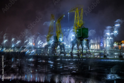 Dźwigozaury - Cranesaurs - colorfully illuminated cranes on the quay of Szczecin Łasztownia 