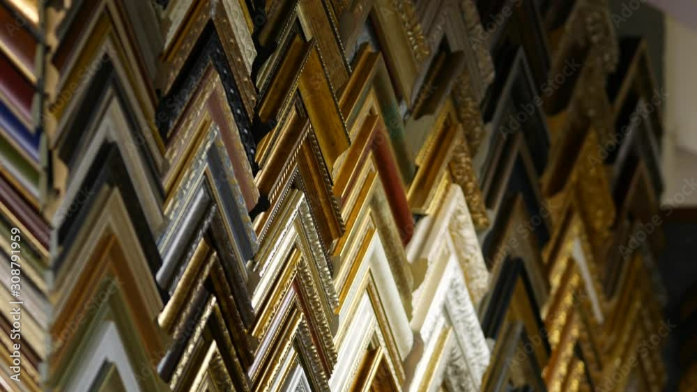 Framing Workshop. Showcase with corners of frames for baguette. A catalog of frames for decorating paintings, photographs and the like.