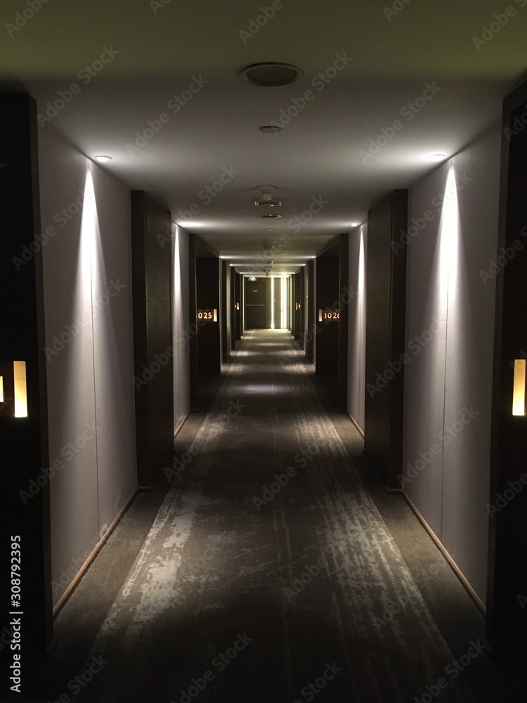 Rhythmic lights in a hotel hallway