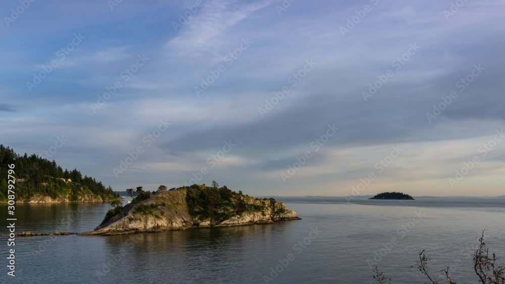 Time Lapse of landscape view on the Pacific Ocean during a vibrant summer sunset. Taken in Whytecliff Park, Horseshoe Bay, West Vancouver, BC, Canada. Time Lapse of landscape view on the Pacific Ocean during a vibrant summer sunset. Taken in Whytecliff Park, Horseshoe Bay, West Vancouver, BC, Canada.