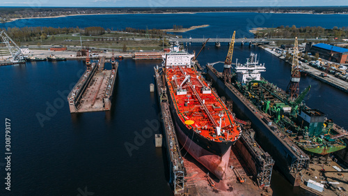 Fotografi Tanker vessel repair in dry dock Shipyard, Drone shot