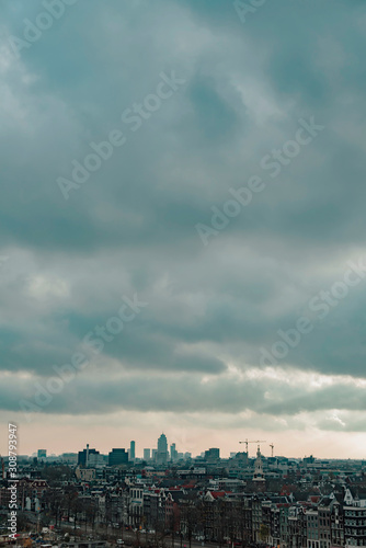 Old centre of the city of Amsterdam under cloudy sky in autumn. High angle view.