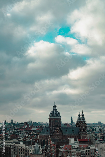 Old centre of the city of Amsterdam under cloudy sky in autumn. High angle view.