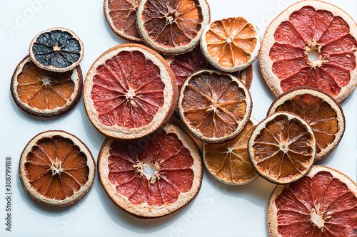 Still life of sliced citrus, orange slices, grapefruit, lemons.