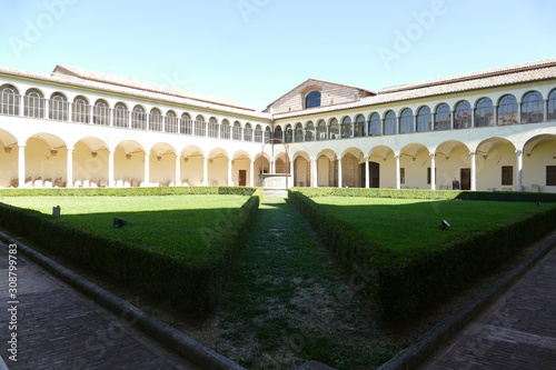 Convent of Basilica of San Domenico, Perugia. Convent of Basilica of San Domenico has two cloisters surrounded by arcades with columns and inside a garden with a well.