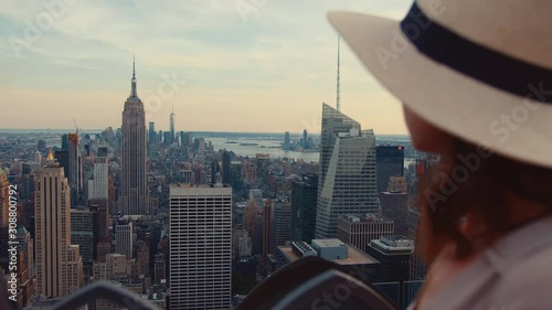 Young woman on the roof of a skyscraper in New York