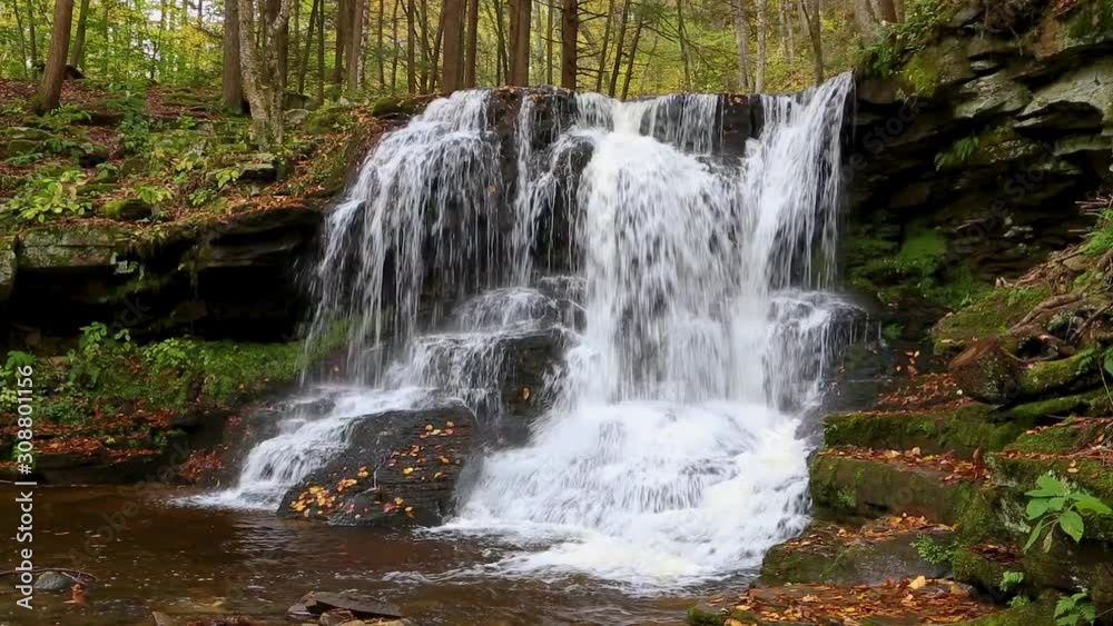 A beautiful splashing waterfall, Dry Run Falls, in the autumn woods of western Pennsylvania is featured in this seamless video loop A beautiful splashing waterfall, Dry Run Falls, in the autumn woods of western Pennsylvania is featured in this seamless video loop