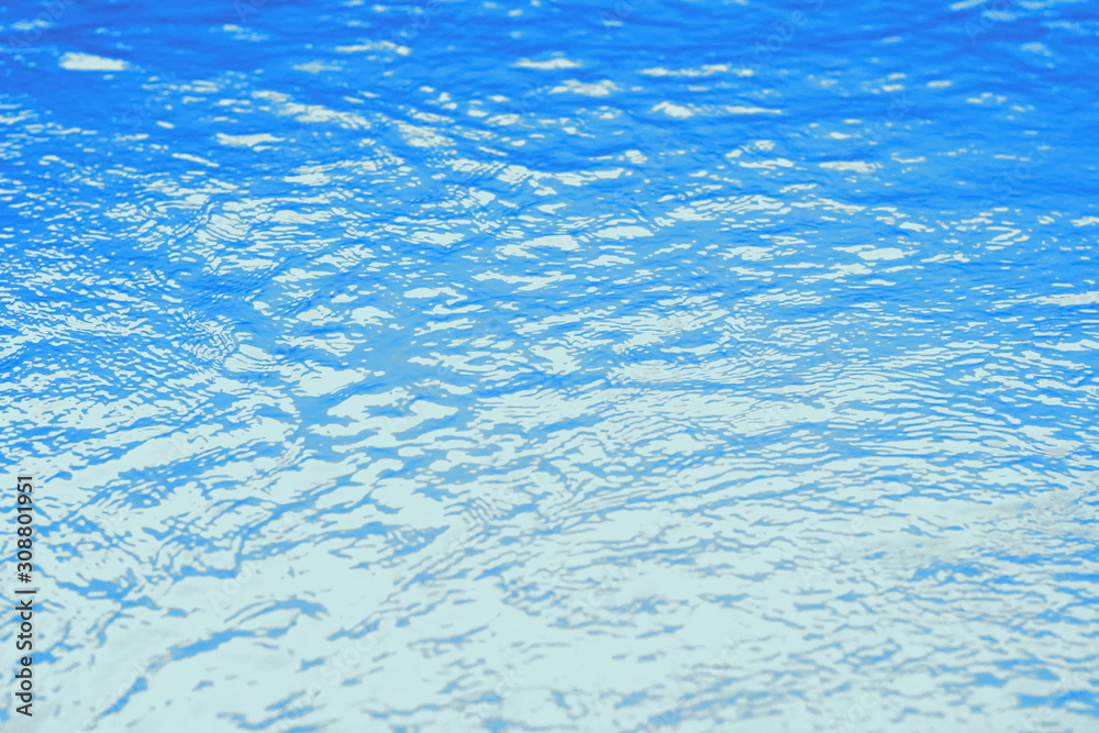 Obraz premium Surface of blue swimming pool,background of water in swimming pool. Water background blue.