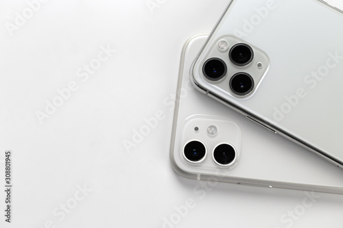 Two smartphones close-up on a white background. photo
