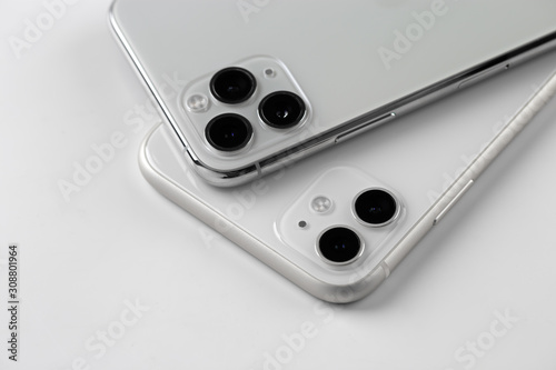 Two smartphones close-up on a white background.