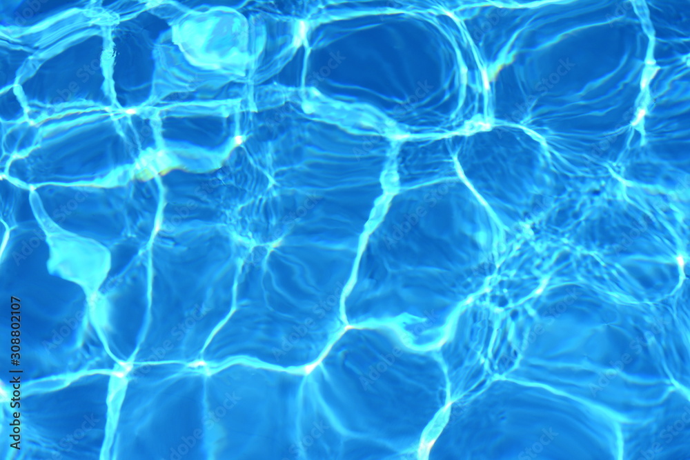 Surface of blue swimming pool,background of water in swimming pool. Water background blue. Surface of blue swimming pool,background of water in swimming pool. Water background blue.
