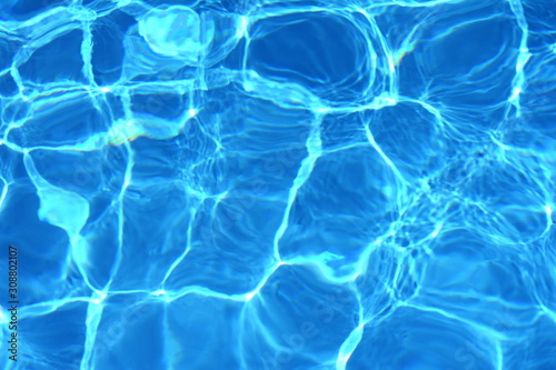Surface of blue swimming pool,background of water in swimming pool. Water background blue. © Sanja