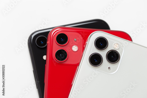 Three smartphones close-up on a white background.
