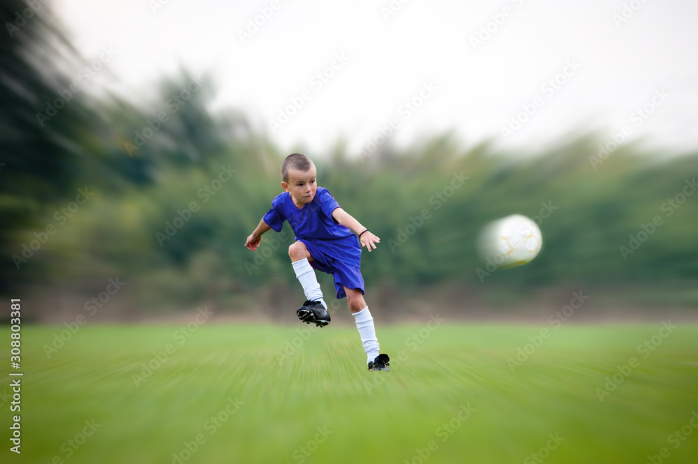 Soccer kid kicking a ball