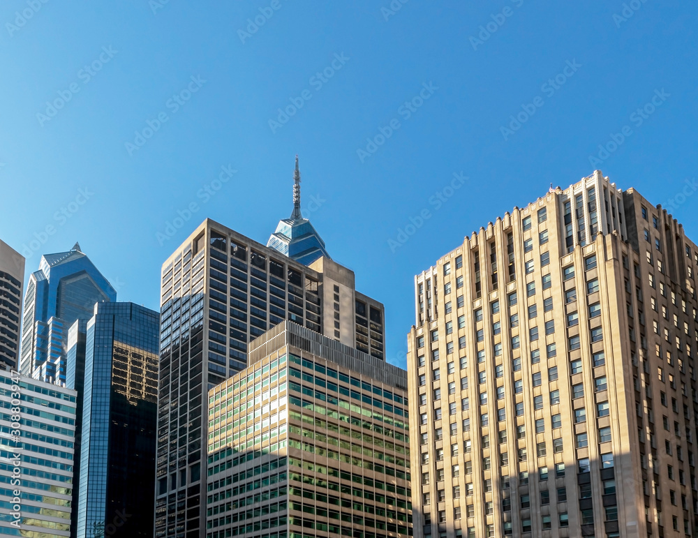 Highrise buildings in Philadelphia, Pennsylvania, downtown. Skyscrapers on blue sky.