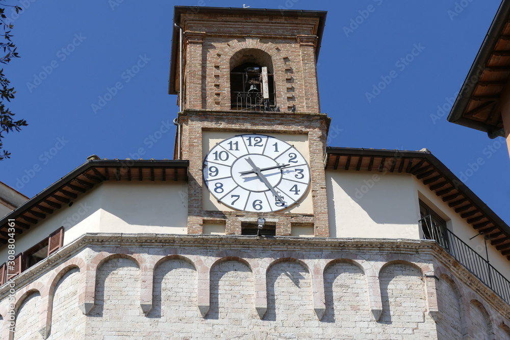 Sant'Ercolano church, Perugia. Facade of Sant'Ercolano church, the patron of Perugia, with a double flight of steps and the bell tower with an ancient clock. It is situated in Perugia, Italy.