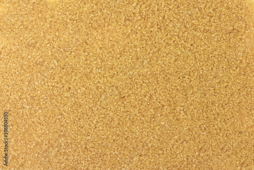 Closeup pile brown sugar full background. Top view. Flat lay.