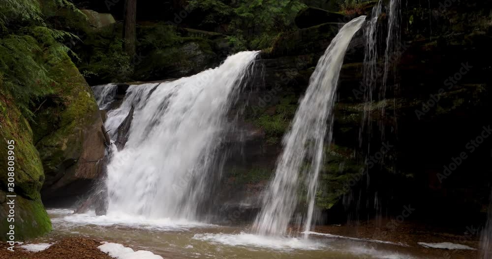 Hidden Falls, a beautiful waterfall in the Hocking Hills of Ohio, flows full with spring rains in this seamlessly looping video footage. Hidden Falls, a beautiful waterfall in the Hocking Hills of Ohio, flows full with spring rains in this seamlessly looping video footage.