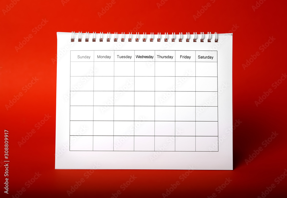 Blank paper calendar on red background. Planning concept Blank paper calendar on red background. Planning concept