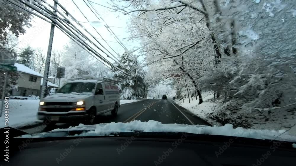 driving through suburban roads after the first snow of the season in North America driving through suburban roads after the first snow of the season in North America