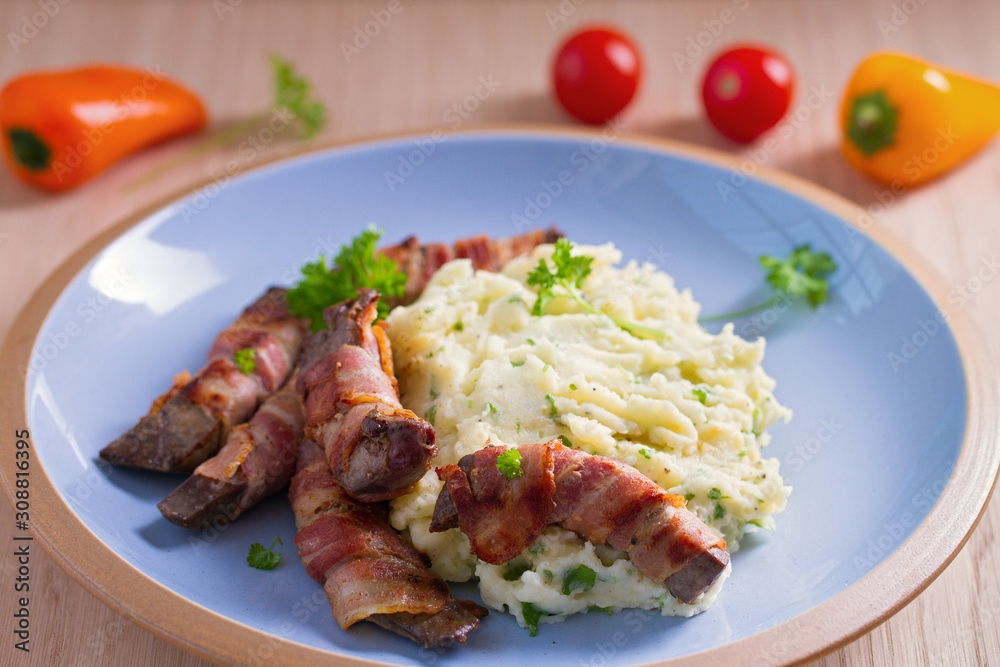 Lamb liver wrapped in bacon with mash potato