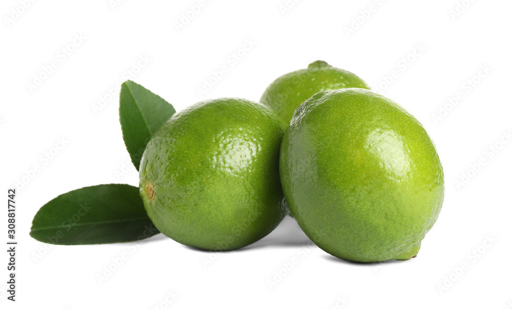 Fresh ripe limes with green leaves isolated on white Fresh ripe limes with green leaves isolated on white