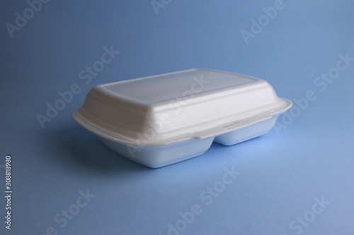 Plastic container on blue background