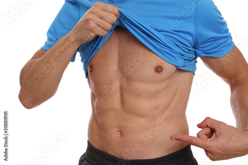 Man showing his strong abdominal muscles. Bodybuilding, sport, fitness ,workout, active lifestyle concept.