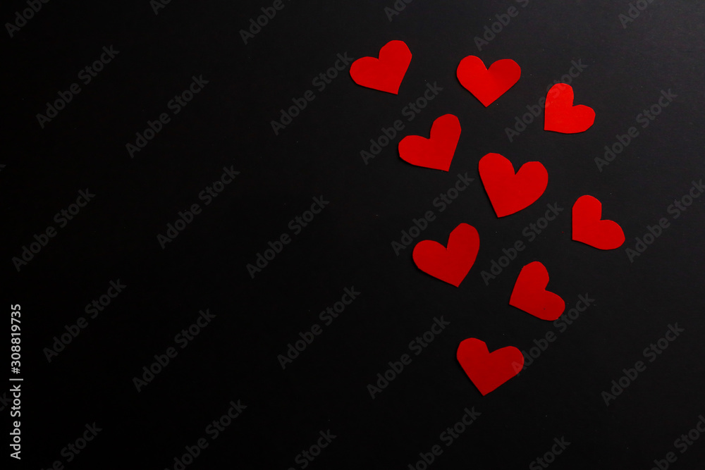 Paper hearts on black background Paper hearts on black background