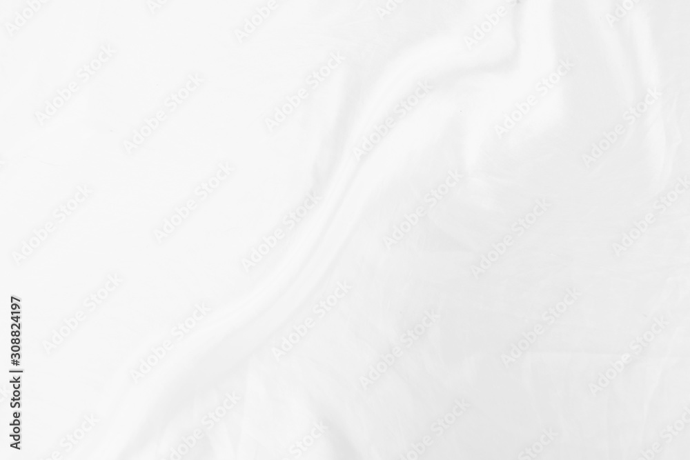 Top view Abstract White cloth background with soft waves.Wave and curve overlapping with different shadow of color,white fabric, crumpled fabric.