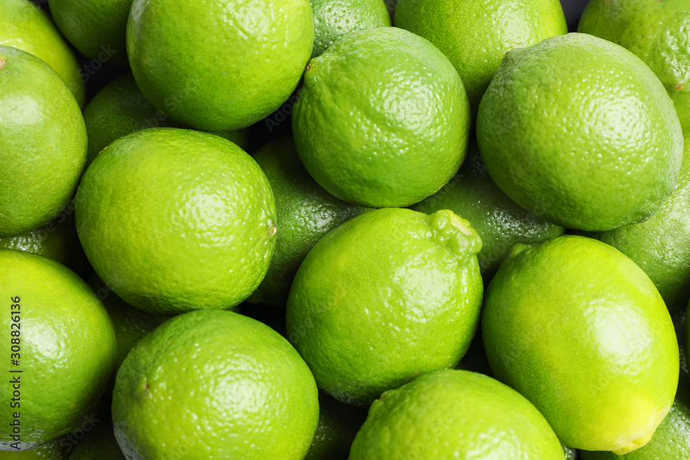 Fresh ripe green limes as background, top view Fresh ripe green limes as background, top view