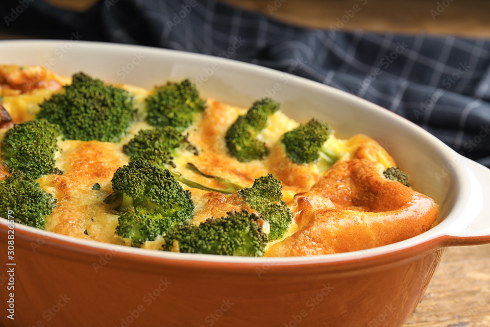 Tasty broccoli casserole in baking dish, closeup