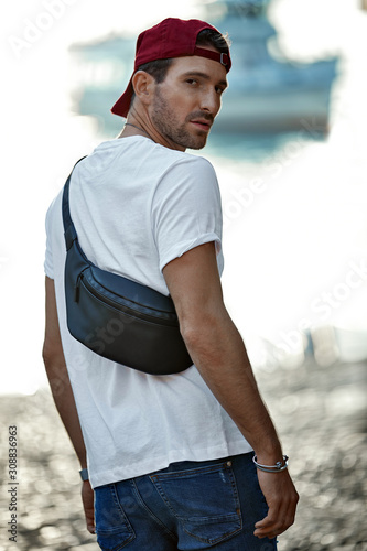 Fotografija Handsome man in daily outfit wear bum bag