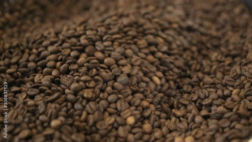Close view of grinding roasted coffee beans in machine. 4K Close view of grinding roasted coffee beans in machine. 4K