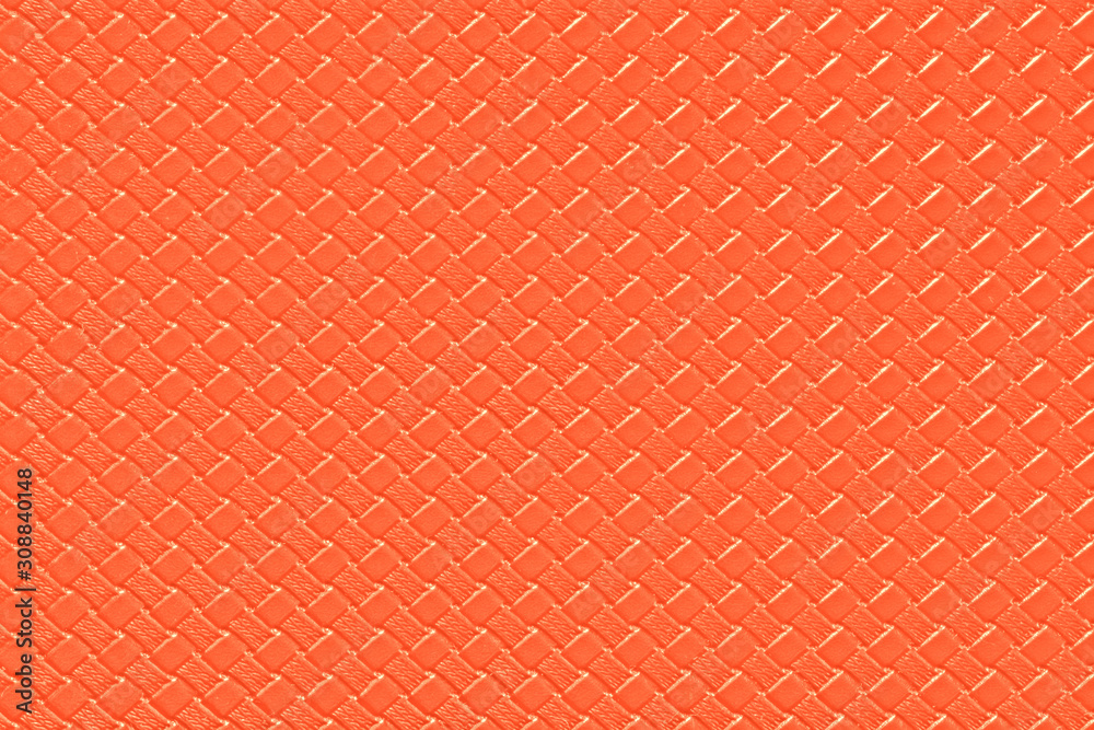 Fototapeta premium bright orange leather background with imitation weave texture. Glossy dermantine, artificial leather structure.