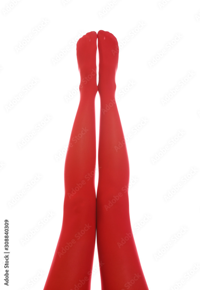 Woman wearing red tights on white background, closeup of legs Woman wearing red tights on white background, closeup of legs