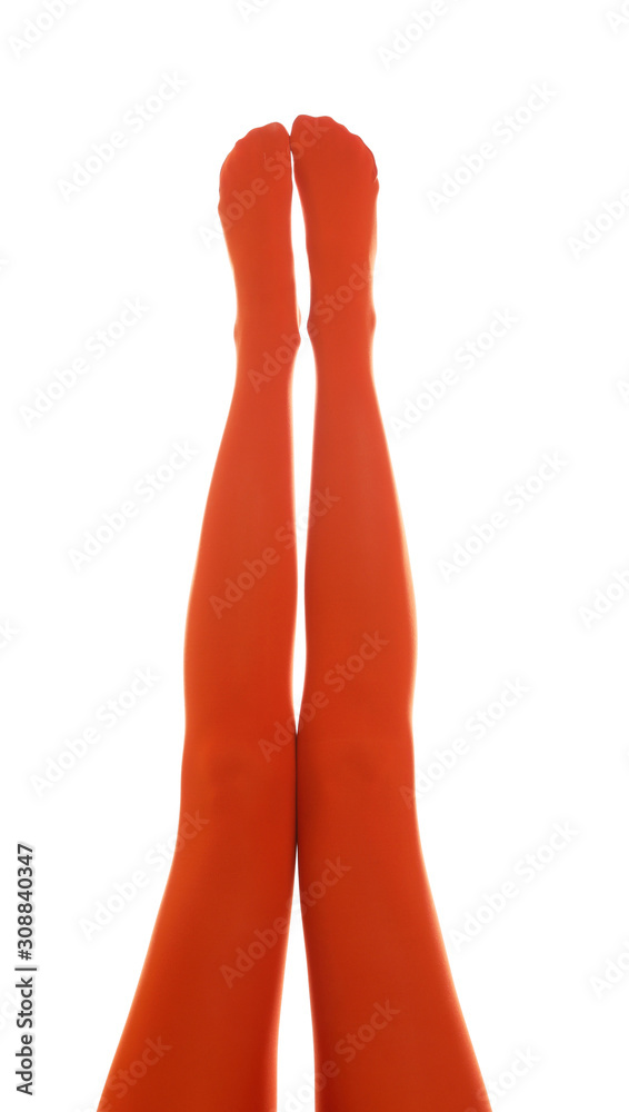 Woman wearing terracotta tights on white background, closeup of legs Woman wearing terracotta tights on white background, closeup of legs