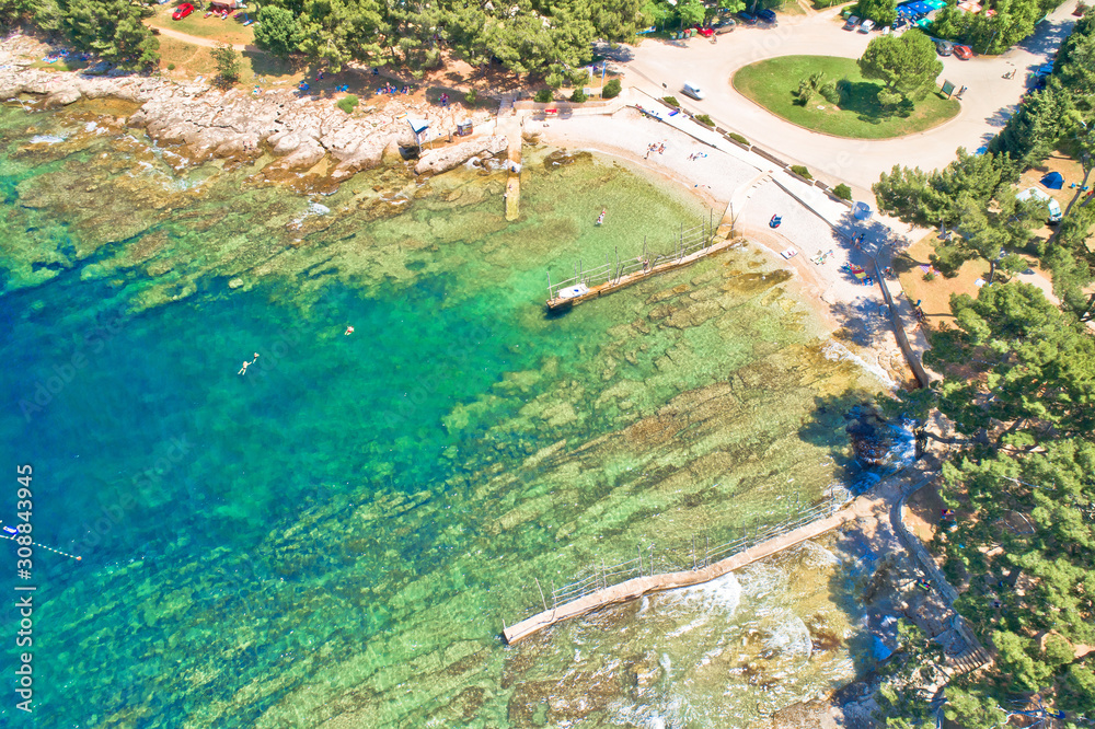 Camping by the sea and crystal clear stone beach aerial view in Savudrija