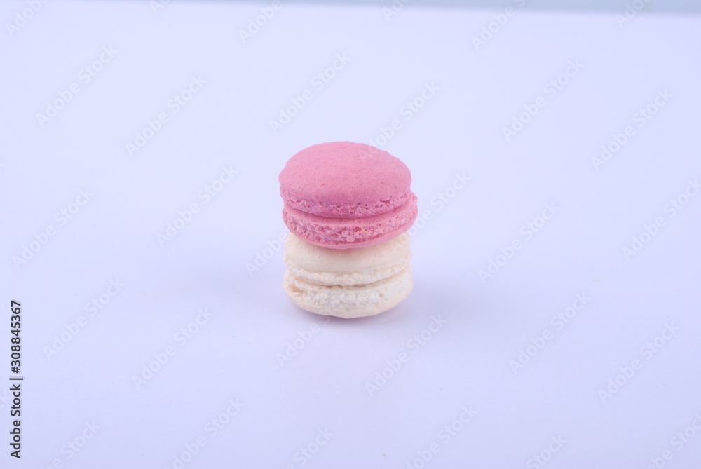 Tasty macarons on white background