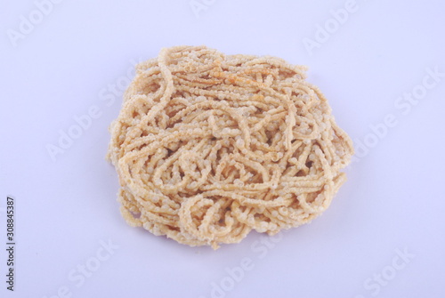 Mee siput is a famous local snack eaten with sambal or chili sauce.