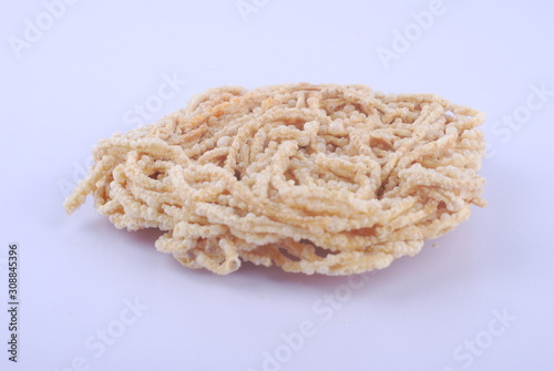Mee siput is a famous local snack eaten with sambal or chili sauce.