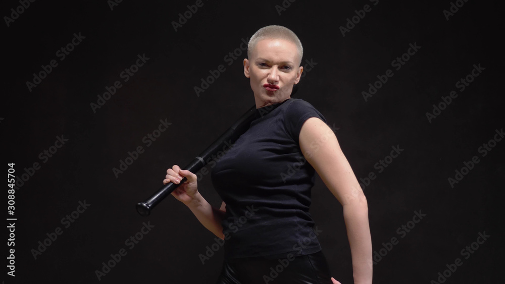 beautiful short haired blond woman with a baseball bat on black background beautiful short haired blond woman with a baseball bat on black background