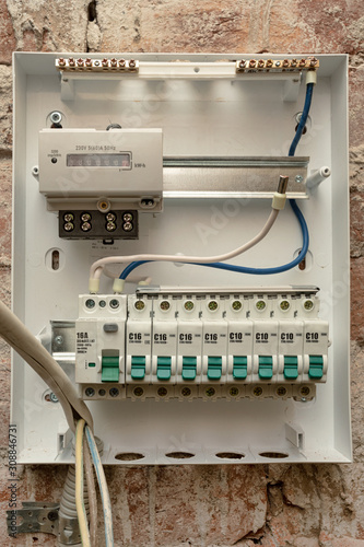 Indoor home open electrical breaker panel.