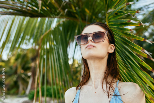 portrait of young woman in sunglasses © SHOTPRIME STUDIO
