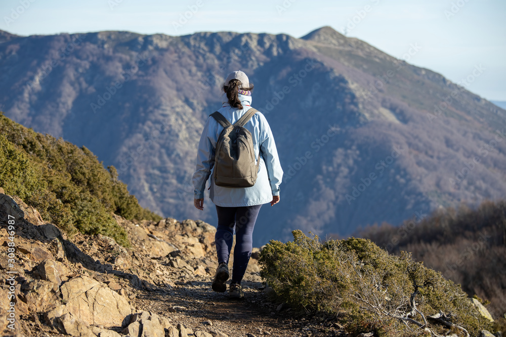 Spanish tourist woman walking in the Spanish mountain Montseny